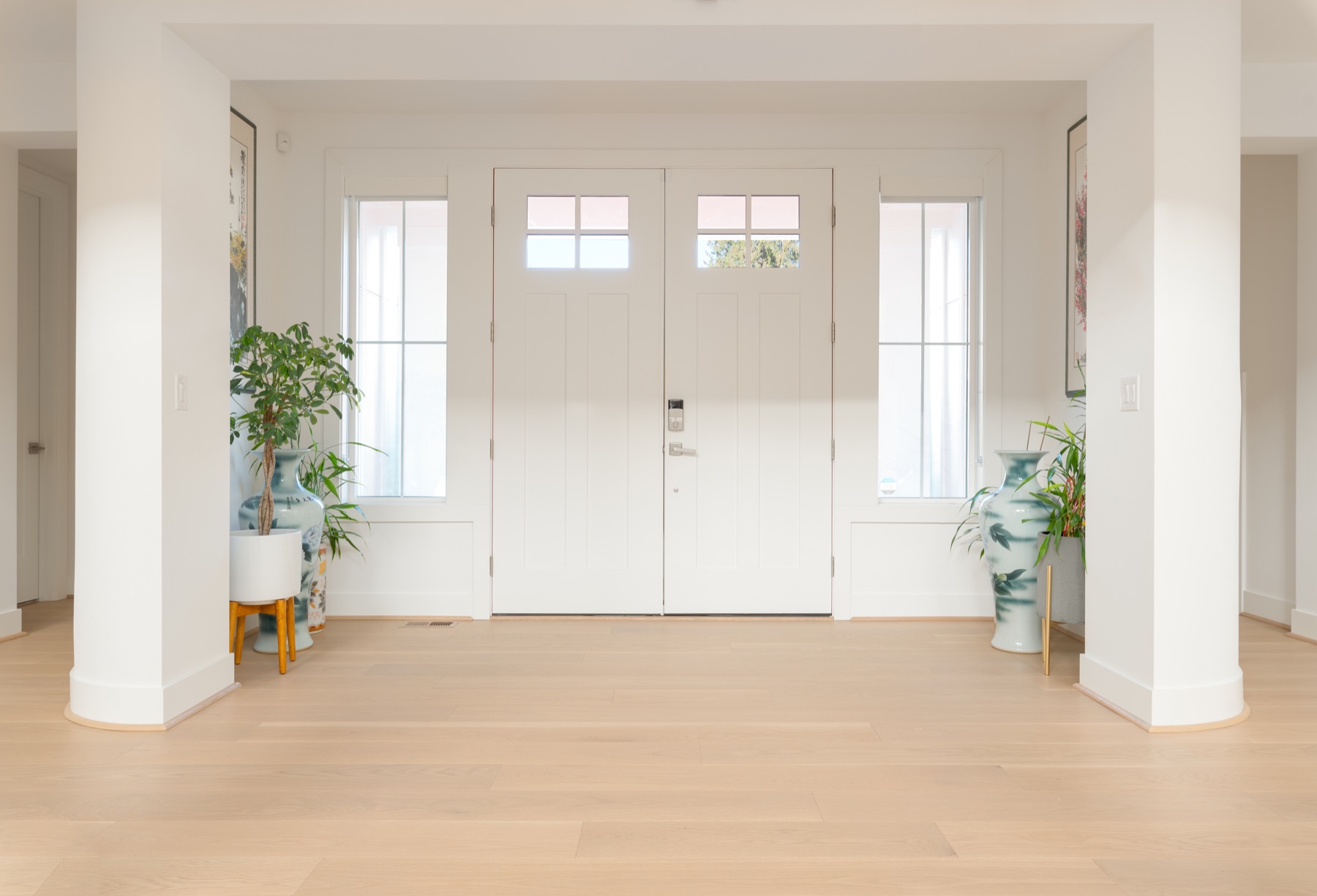 Bright entry and custom white oak flooring by LeviArs