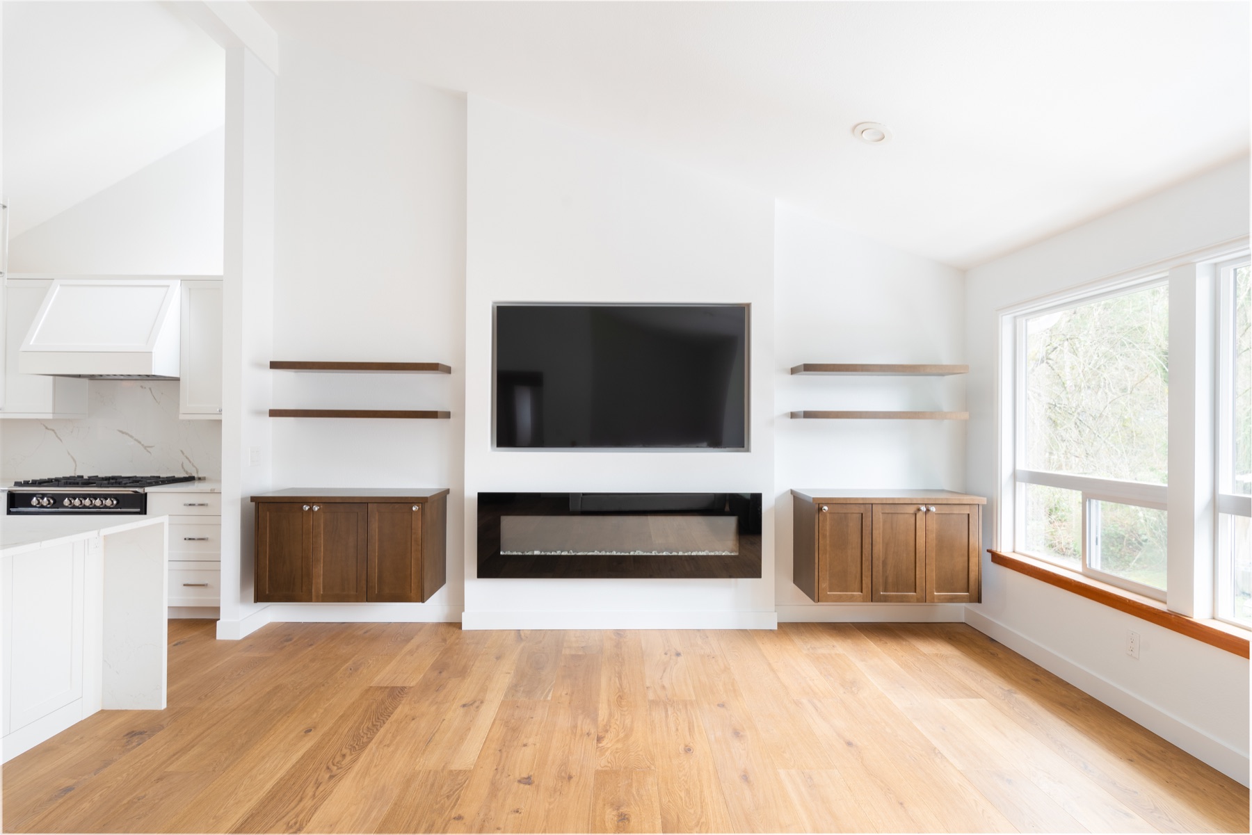 Modern white fireplace with custom built-in shelves